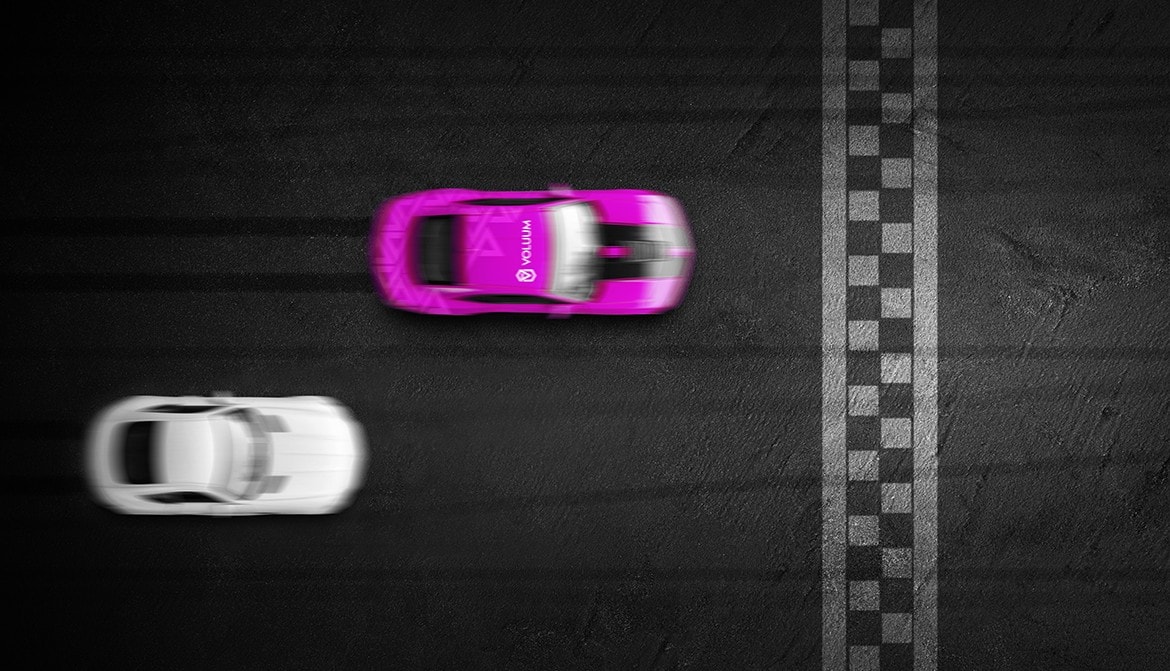 A drag race between two cars. The leading car is in Voluum colors.