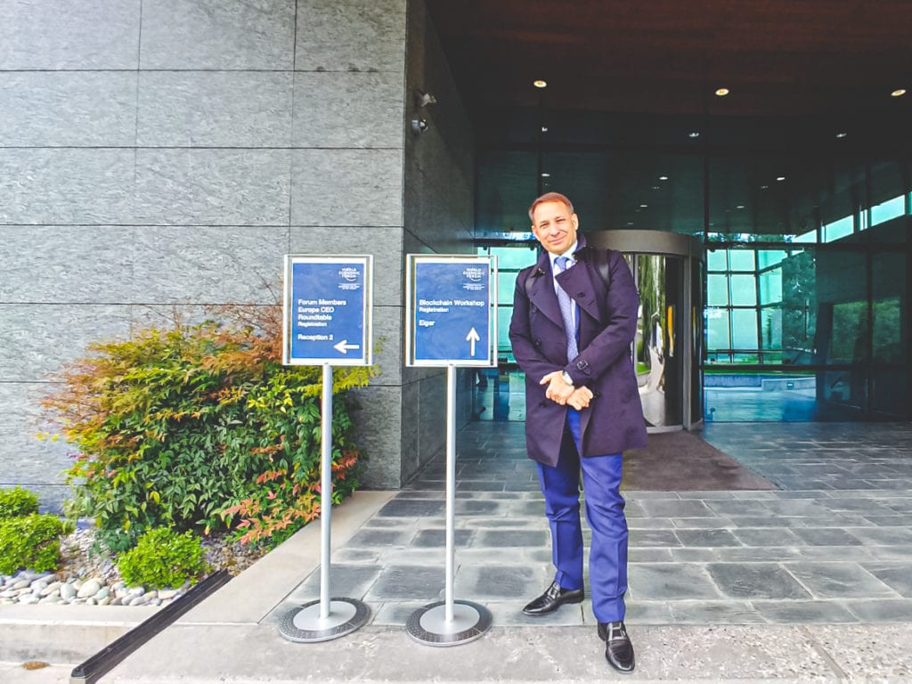 Dr. John Malatesta standing outside the World Economic Forum Europe CEO Roundtable