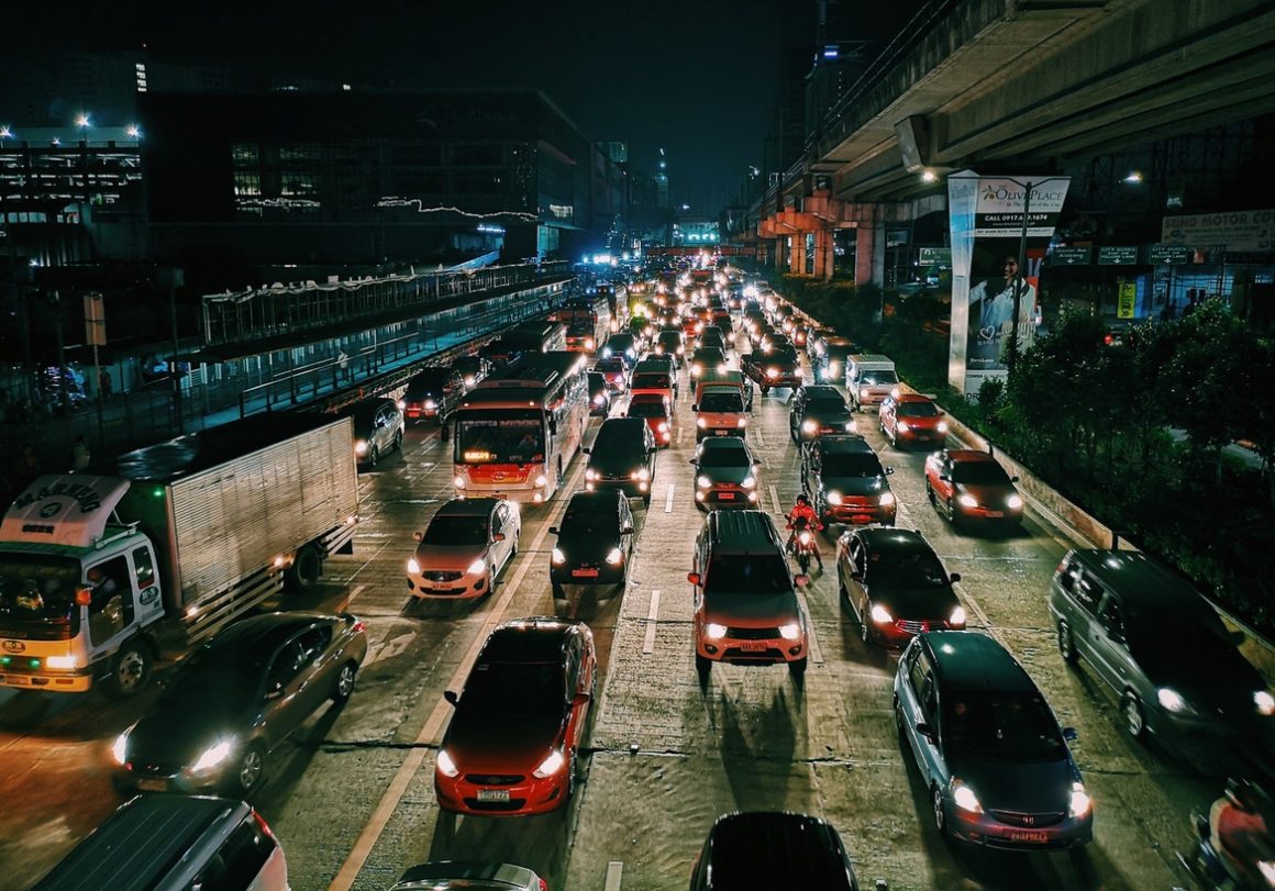 a traffic jam at night on a freeway in a city
